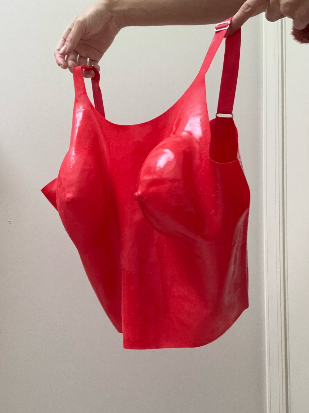 Red latex rubber bustier sleeveless vest top with moulded bra cups